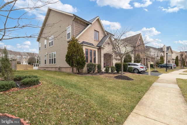 view of home's exterior with a yard and a residential view