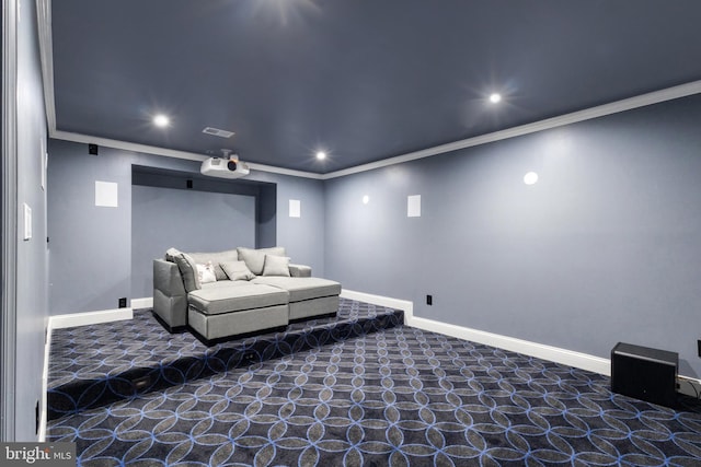 carpeted home theater room featuring visible vents, recessed lighting, crown molding, and baseboards