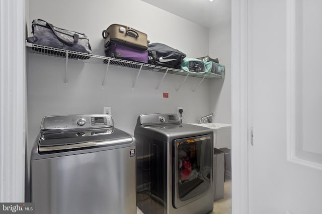 washroom featuring laundry area and separate washer and dryer