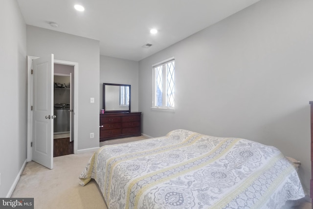 bedroom with visible vents, a walk in closet, baseboards, carpet, and recessed lighting