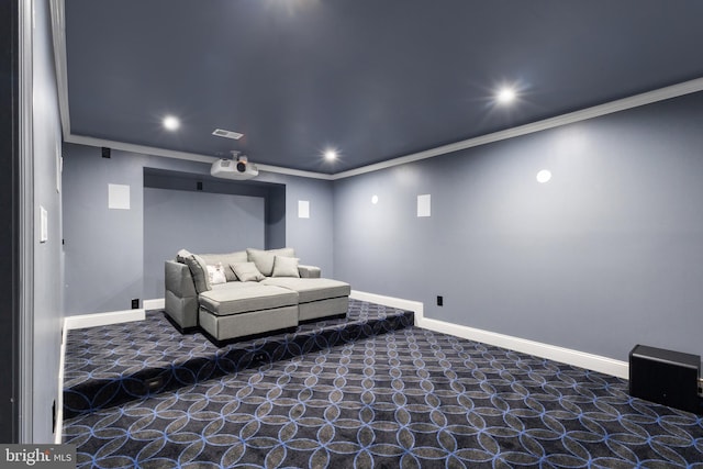 carpeted cinema room featuring recessed lighting, visible vents, baseboards, and crown molding