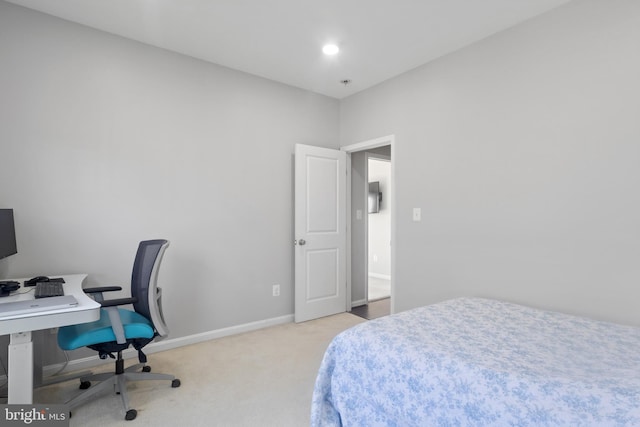 bedroom featuring recessed lighting, light colored carpet, and baseboards