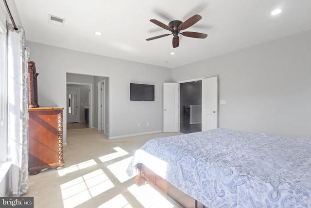 bedroom featuring light carpet, visible vents, and recessed lighting