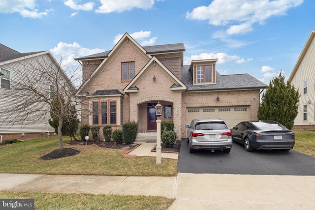 view of front facade featuring aphalt driveway, an attached garage, brick siding, and a front lawn