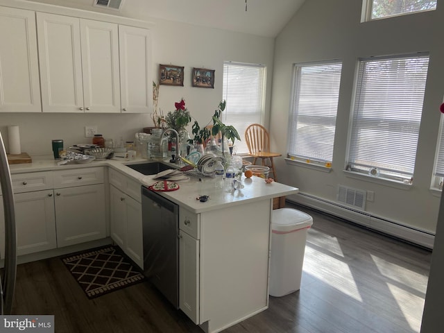 kitchen with a sink, stainless steel dishwasher, a peninsula, light countertops, and vaulted ceiling