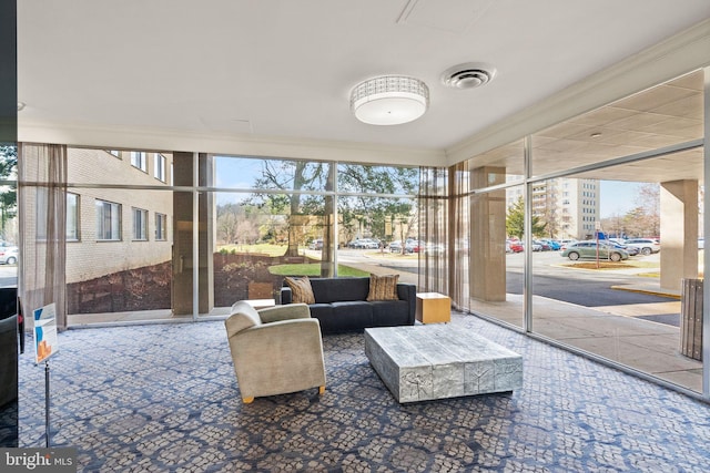 sunroom featuring a wealth of natural light and visible vents