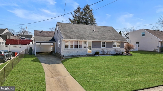 new england style home featuring a front lawn, driveway, stone siding, fence, and a shingled roof