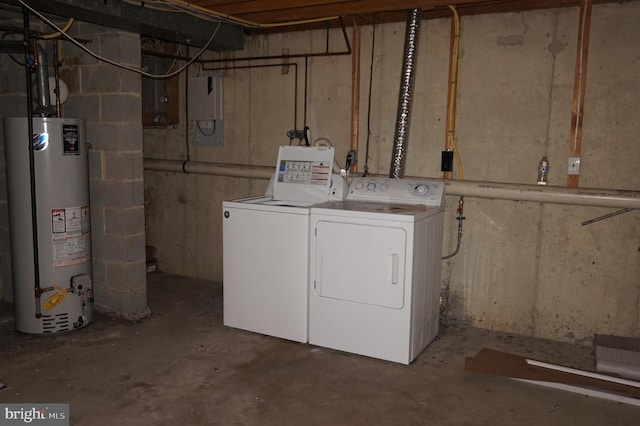 laundry area with laundry area, gas water heater, and washer and dryer