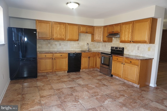 kitchen with under cabinet range hood, backsplash, black appliances, and a sink