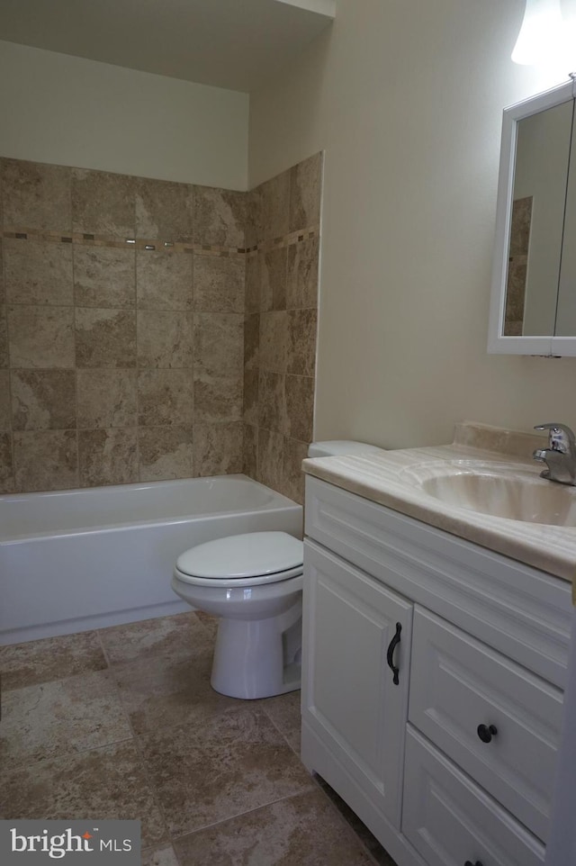 full bath featuring vanity, toilet, and shower / bath combination