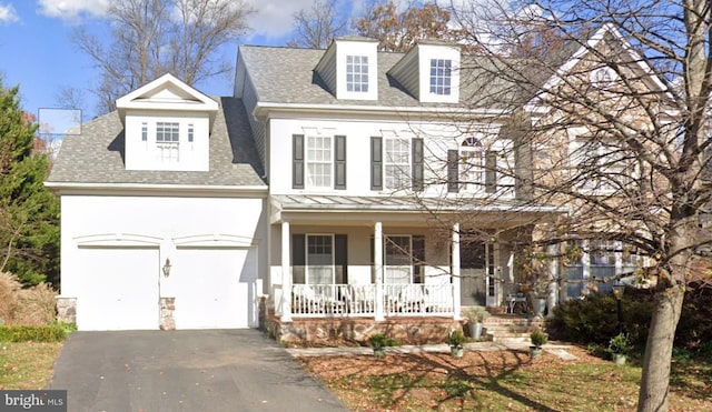 view of front of house featuring a shingled roof, aphalt driveway, a porch, stucco siding, and a garage