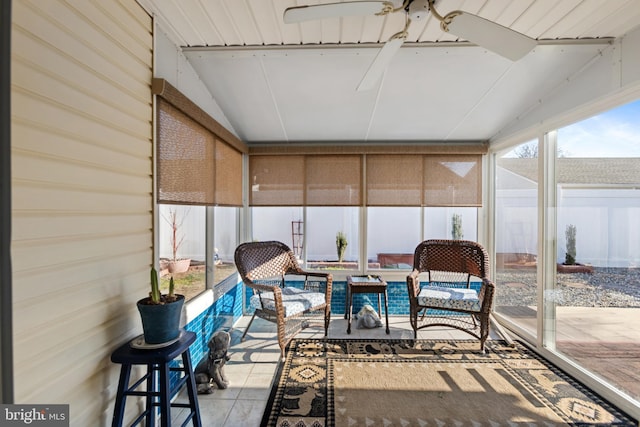 sunroom featuring lofted ceiling