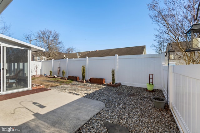 view of yard featuring a patio and a fenced backyard