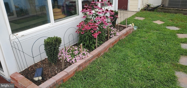 view of yard with central AC