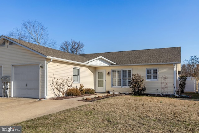 ranch-style house with concrete driveway, a front lawn, a garage, and roof with shingles