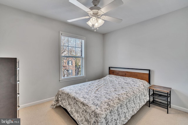 bedroom with carpet flooring, ceiling fan, and baseboards