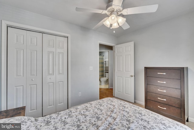 bedroom with a closet, baseboards, and ceiling fan