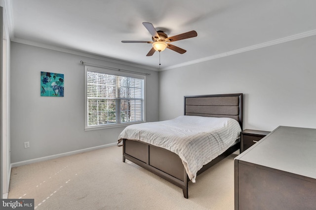 bedroom with carpet flooring, ceiling fan, baseboards, and ornamental molding