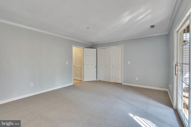 unfurnished bedroom with carpet, baseboards, and ornamental molding