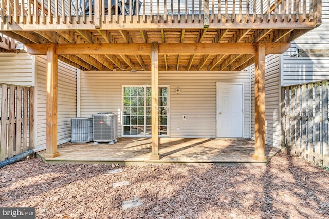 view of patio / terrace with central air condition unit and a deck