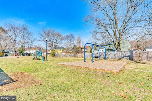 view of yard with fence and playground community