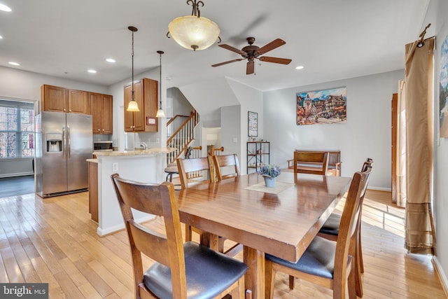 dining area with recessed lighting, stairway, light wood-style flooring, and a ceiling fan