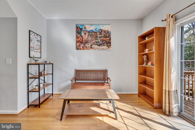 sitting room with light wood-style floors and baseboards