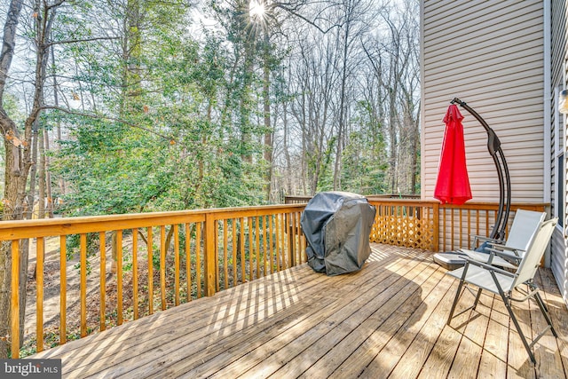 wooden deck with area for grilling