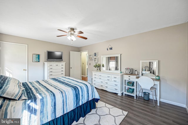 bedroom featuring dark wood-style floors, ceiling fan, and baseboards