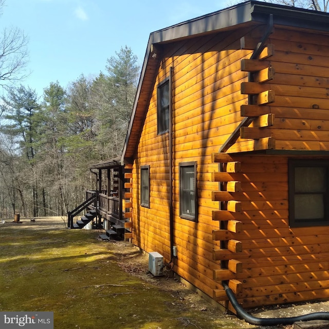 view of home's exterior featuring log siding