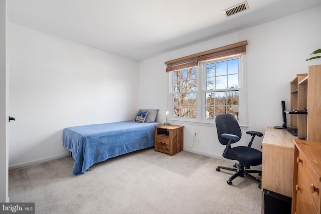 bedroom featuring carpet, visible vents, and baseboards