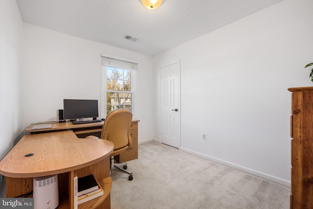 office area with visible vents, baseboards, and carpet floors