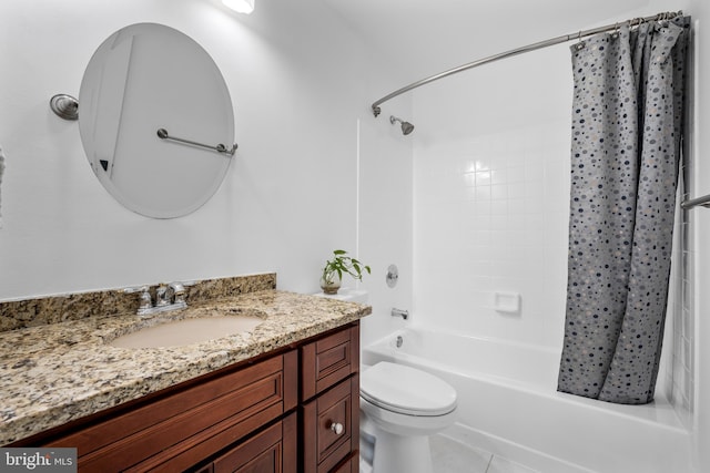 bathroom featuring vanity, shower / bath combination with curtain, and toilet