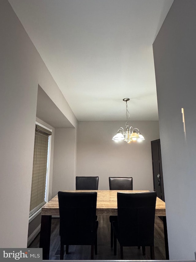 dining space featuring an inviting chandelier