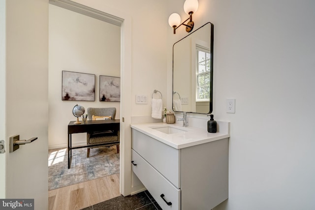 bathroom with vanity and wood finished floors