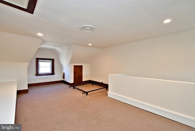 additional living space with vaulted ceiling, recessed lighting, baseboards, and carpet floors