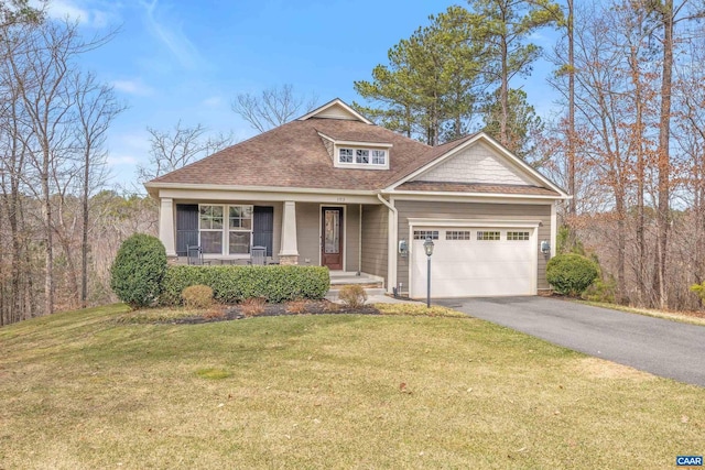 craftsman house featuring a garage, a front lawn, driveway, and a shingled roof