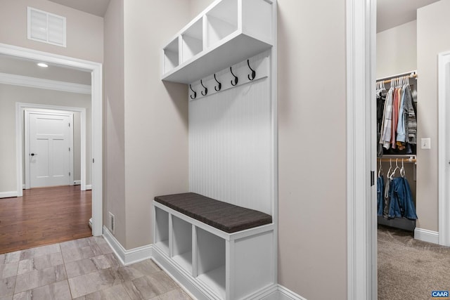 mudroom featuring visible vents and baseboards