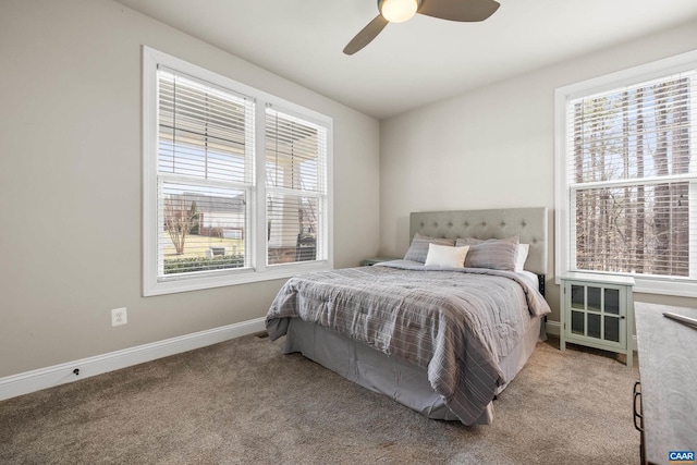 bedroom featuring baseboards, light colored carpet, and ceiling fan