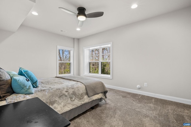 carpeted bedroom featuring visible vents, recessed lighting, a ceiling fan, and baseboards