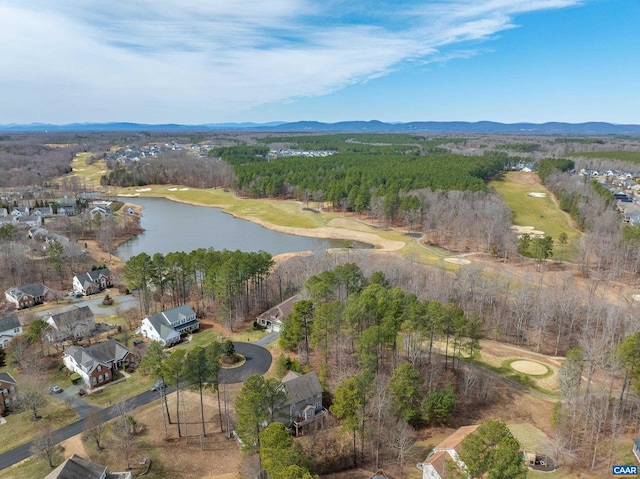 drone / aerial view with a water and mountain view