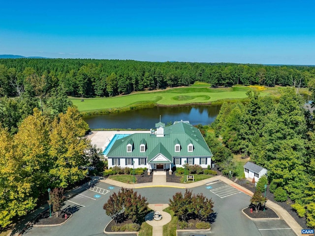 aerial view featuring a water view and a wooded view