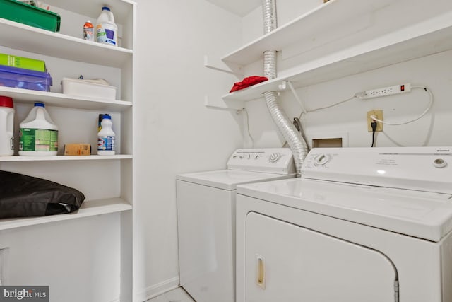 laundry room with laundry area and washer and clothes dryer