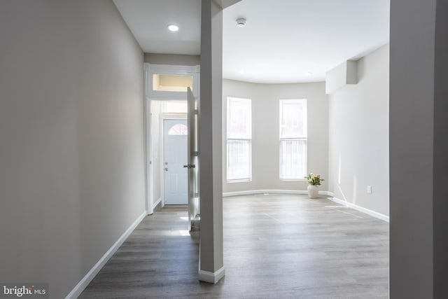 foyer with recessed lighting, wood finished floors, and baseboards