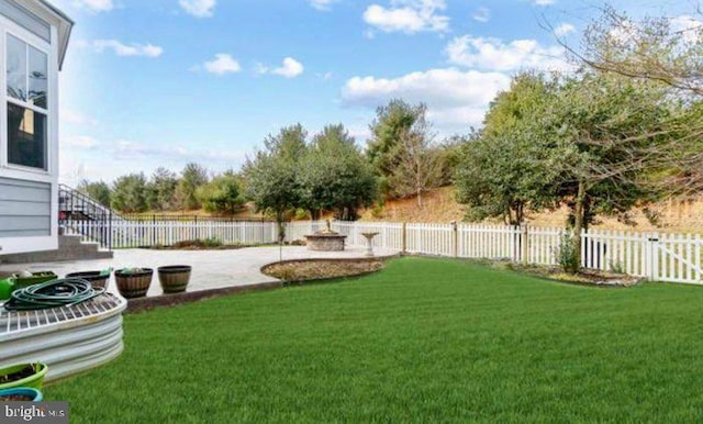 view of yard featuring a fenced backyard and a patio area