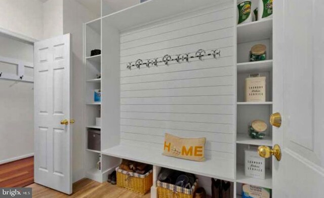 mudroom with wood finished floors