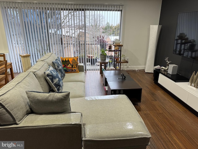 living room with wood finished floors and baseboards