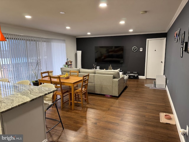 living area with dark wood finished floors, recessed lighting, baseboards, and ornamental molding