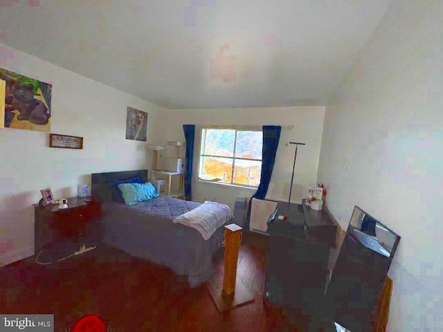 bedroom with wood finished floors