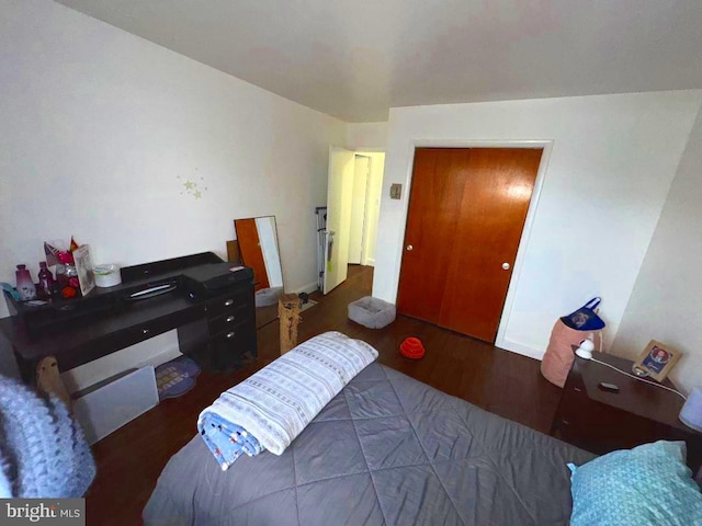 bedroom with wood finished floors